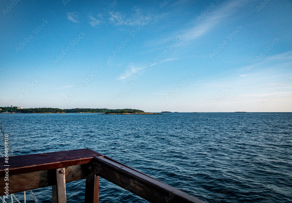 view from a boat at croatia in summer with bleu sky and small islands