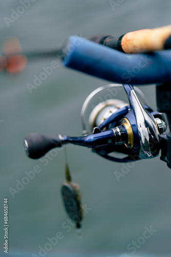 close-up Fishing tackle fishing spinning hooks and baits fisherman on the reservoir feeder free style method