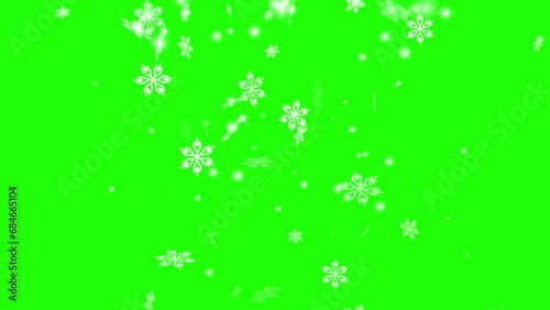 animation of falling snowflakes (green background for chroma key use). motion graphic elements.