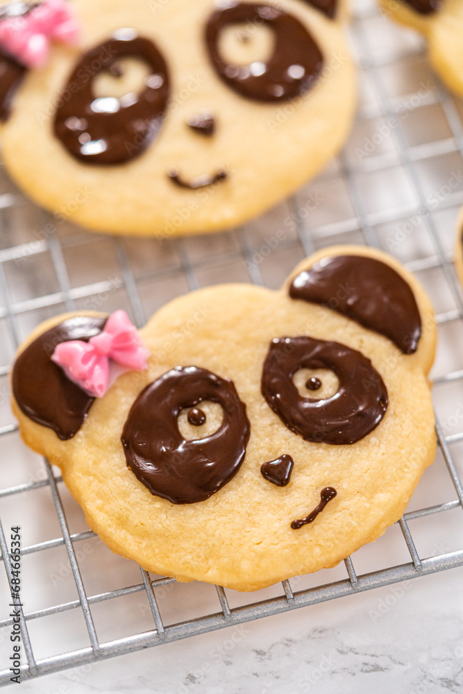 Panda shaped shortbread cookies with chocolate icing