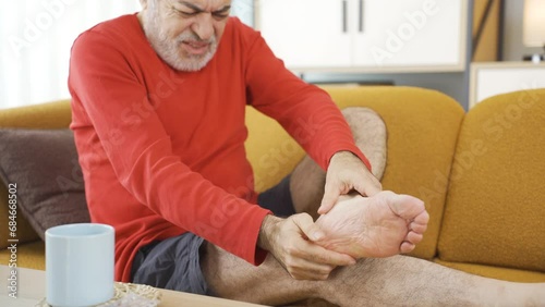 Man with pain in his feet and heels.