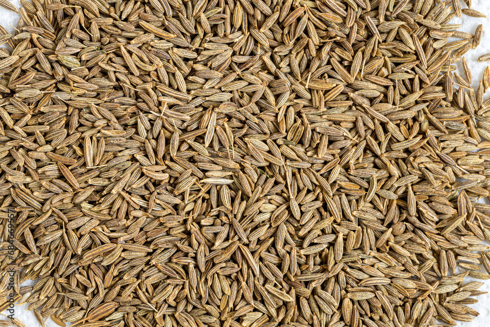 Cumin Jeera spice background. close-up view of zira. Cumin seeds from above. High angle photo of zira jeera cumin spices Cumin Jeera spice background. close-up view of zira. Cumin seeds from above. High angle photo of zira jeera cumin spices