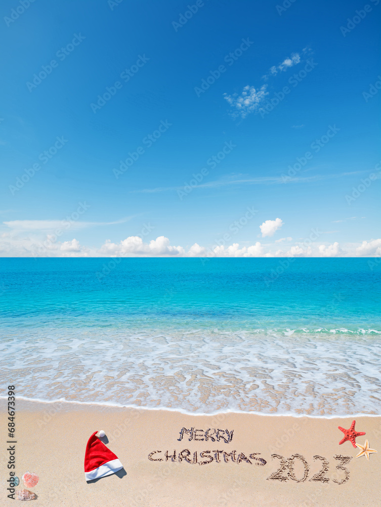 Fototapeta premium merry sandy Christmas 2023 under a blue sky