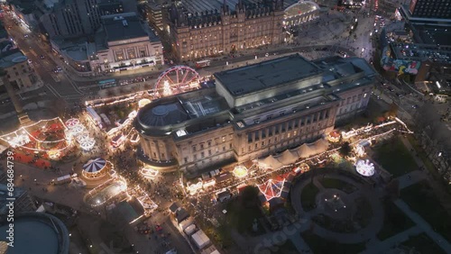 Aerial slow approach look down view of Liverpool Christmas Market round St George's Hall, Merseyside, England photo