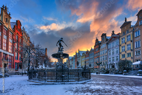 Sunrise in the historic center of Gdansk at the Neptune Fountain, Poland.