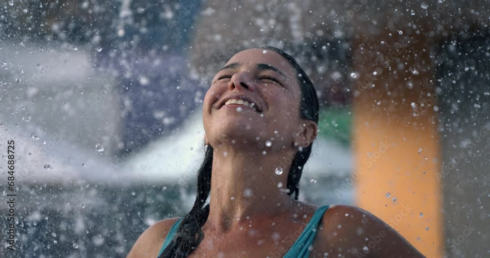 Super slow motion of happy smiling young woman having fun at aqua park during summer holidays family travel vacation Super slow motion of happy smiling young woman having fun at aqua park during summer holidays family travel vacation