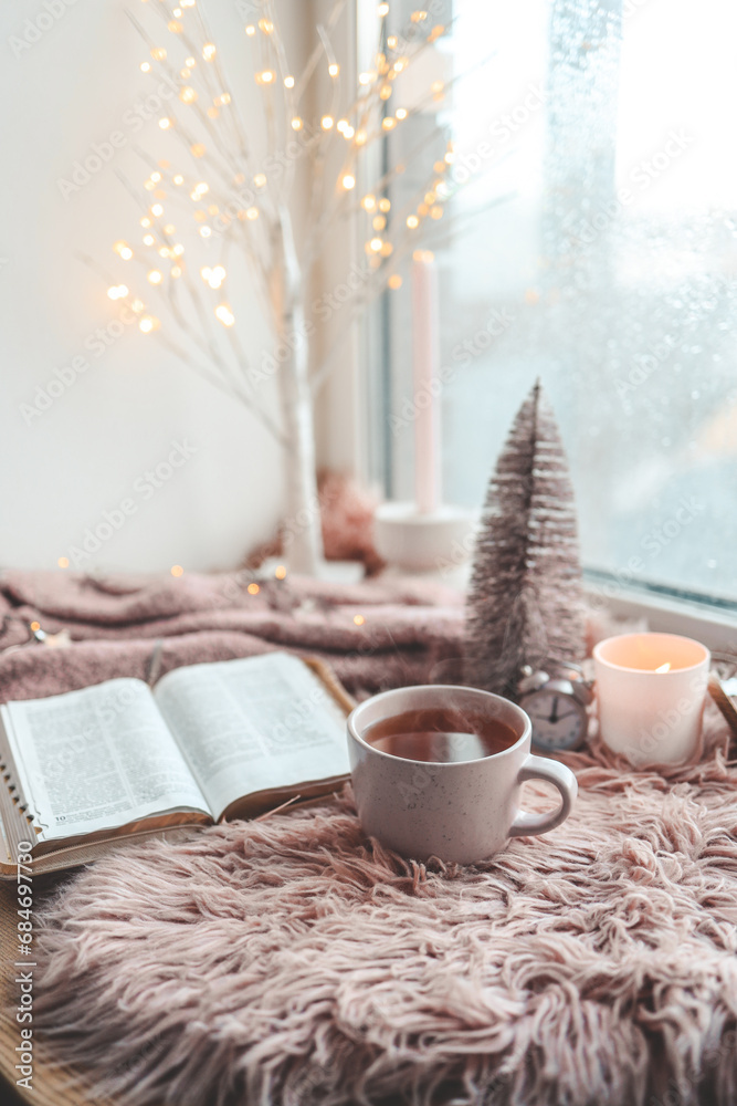 Cup of tea and open Bible, winter morning mood