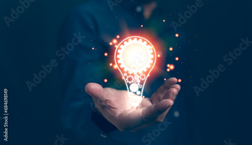 Businessman hands holding light bulb for thinking new idea concept. Innovative technology with innovation. Inspiration of ideas for sustainable business development and communication concepts.