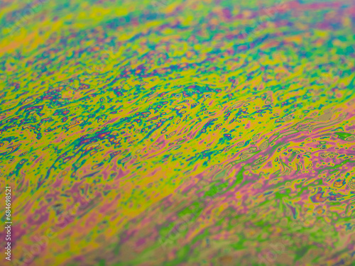 Brightly colored background from the approach to a soap bubble.