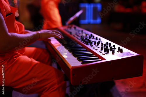 Photography electronic synthesizer at a holiday party in a club