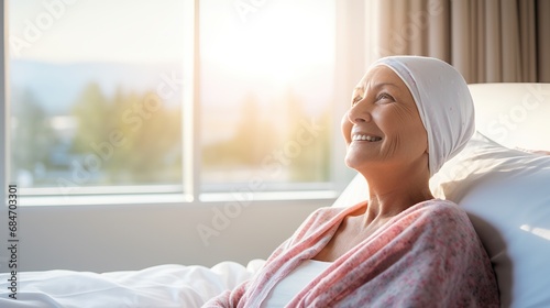 Portrait of the patient woman after chemotherapy female cancer patient wearing head scarf