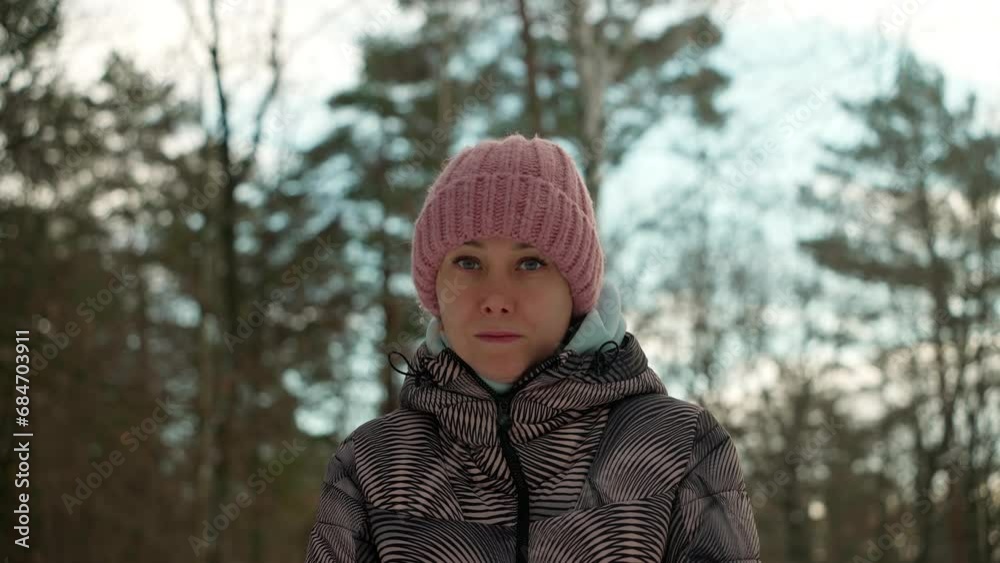 Portrait of a young woman of natural beauty in warm clothes in a winter forest. Portrait of a young woman of natural beauty in warm clothes in a winter forest.