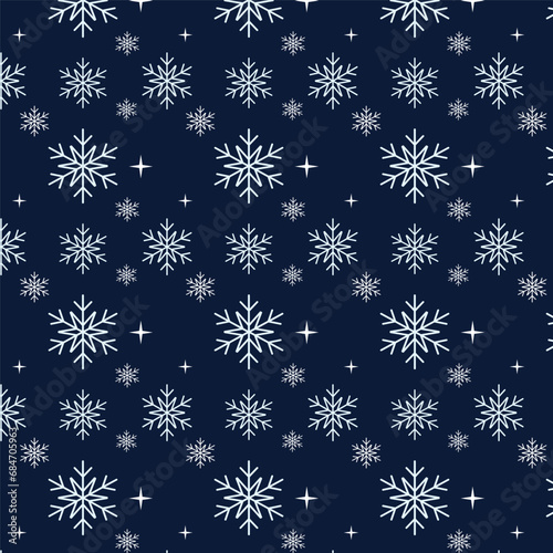 Seamless pattern with snowflakes on blue background.
