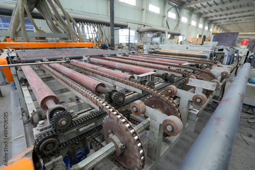 Workers work nervously on the production line of new building materials calcium silicate board, North China photo