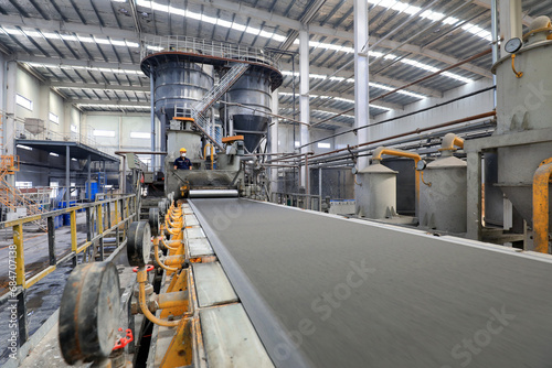 Workers work nervously on the production line of new building materials calcium silicate board, North China
