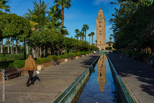 Morocco. Marrakesh. The minaret of the Koutoubia mosque with gardens and canals. photo