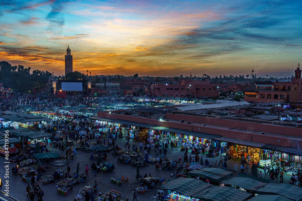 Morocco. Marrakesh. Night activity on Jemaa el Fna Square at sunset - obrazy, fototapety, plakaty 