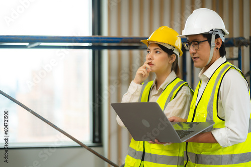 Female engineer using lapto...
