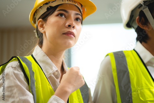 Female engineer using lapto...