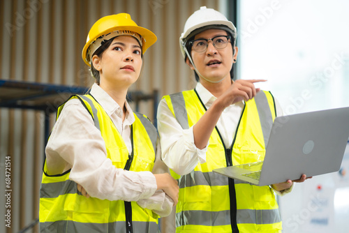 Female engineer using lapto...