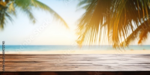 Top of wood table with seascape and palm leaves