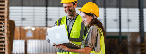 Female engineer using laptop computer for safety control checks or manufacturing maintenance work in factory building or construction site. woman engineer inspector working in industry product line