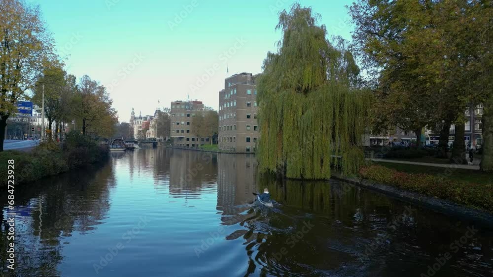 Seeing houses in Amsterdam from the canal and air Seeing houses in Amsterdam from the canal and air