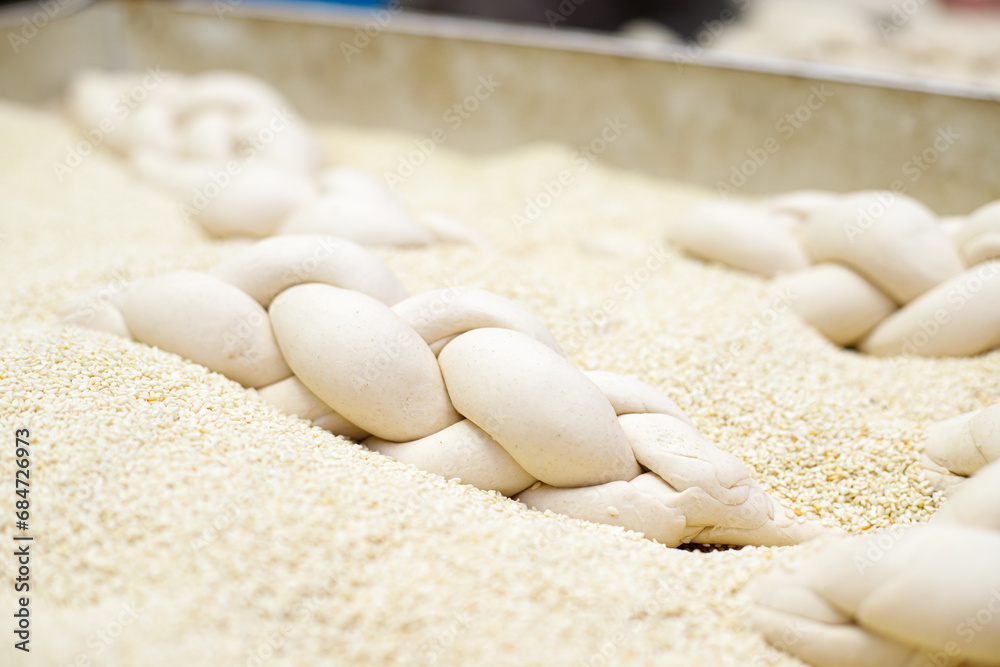Making braided bread in a bakery. Traditional Shabbat challah Making braided bread in a bakery. Traditional Shabbat challah
