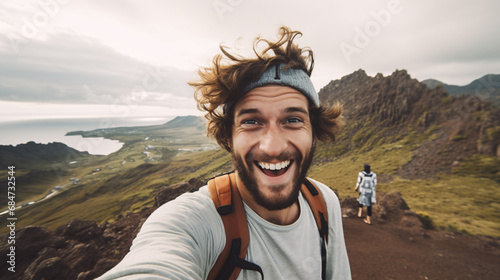 a hiker takes a selfie successfully climbing the mountain, National Hiking Day, a person smiling at the camera on the top of the mountain, hiking mountains, happy hiker portrait, traveler © graphicbeezstock