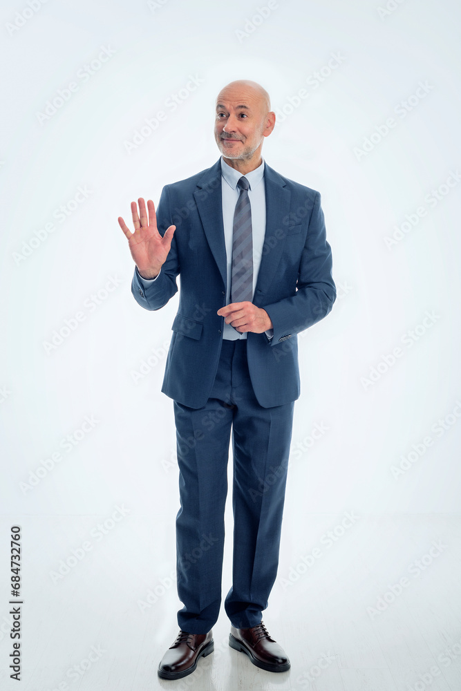 Mid aged businessman wearing suit and tie against isolated background Mid aged businessman wearing suit and tie against isolated background