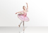 Tender young ballerina performing dancing