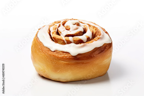 Cinnamon bun with icing isolated on white background.
