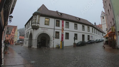 Fussen, Germany, December 5, 2022: SLOW MOTION - The Rathaus Füssen Town Hall is a city hall in Füssen, Ostallgäu, Bavaria. Füssen Town Hall is situated nearby to St. Mang's Abbey and Füssen museum. photo
