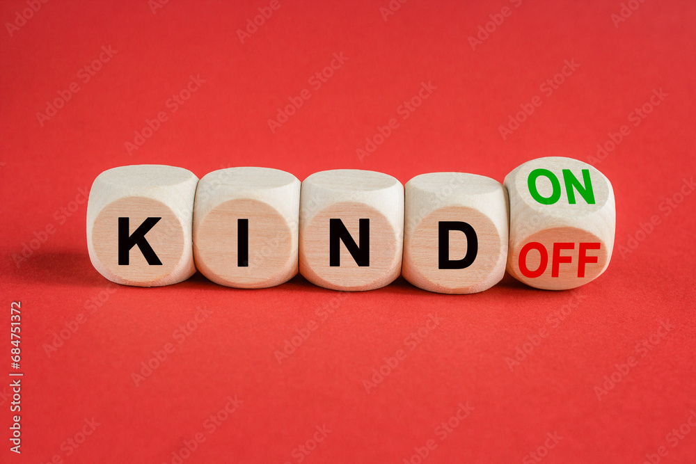 Turned wooden cubes and changes green word Kind off to Kind on. Beautiful red light background. Business and kind on or off concept. Copy space. Turned wooden cubes and changes green word Kind off to Kind on. Beautiful red light background. Business and kind on or off concept. Copy space.