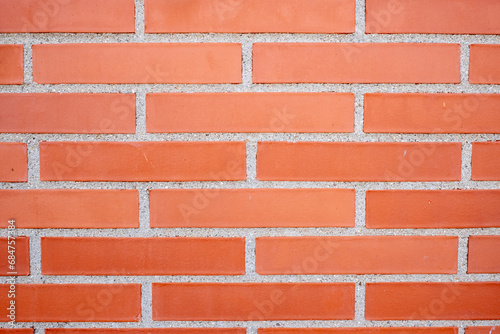 Exposed brick wall texture in red color