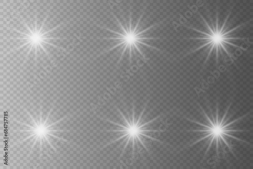 Set of highlights. Flashes of rays of light. The effect of glow, radiance, shine. Collection of various glowing sparks, stars. On a transparent background.