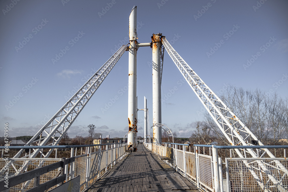 Izyum, Ukraine - November 10, 2023: due to constant shelling of the Russians, who were sitting across the river, the pedestrian bridge was destroyed. the supports were damaged