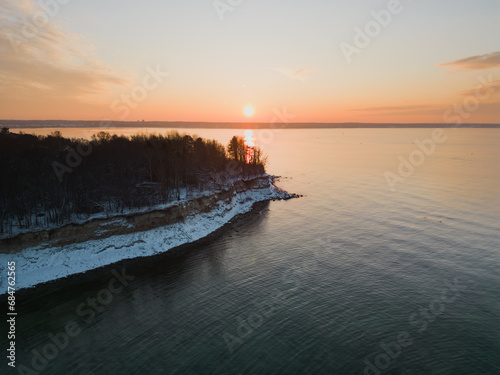 Nature of Estonia, seascape near the steep shores of Kakkumäe at sunset in winter, photo from a drone.
