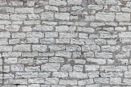Gray brick wall texture, background photo
