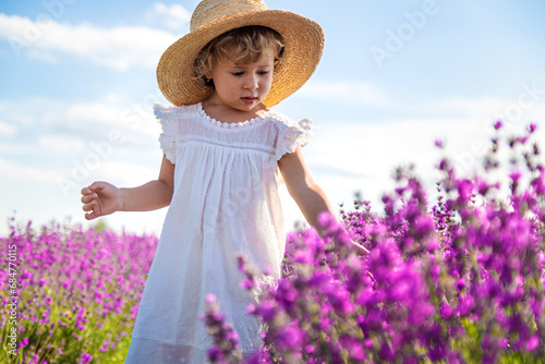 Child in a lavender field. Selective focus.