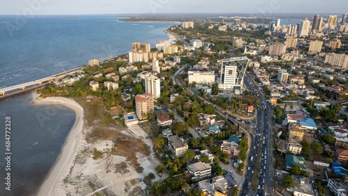this aerial view shows an empty beach and lots of tall buildings