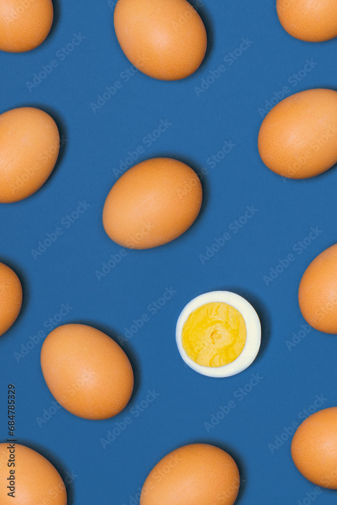 Creative pattern made of boiled eggs against pastel blue background. Easter celebration idea. Christian holiday backdrop. Creative pattern made of boiled eggs against pastel blue background. Easter celebration idea. Christian holiday backdrop.