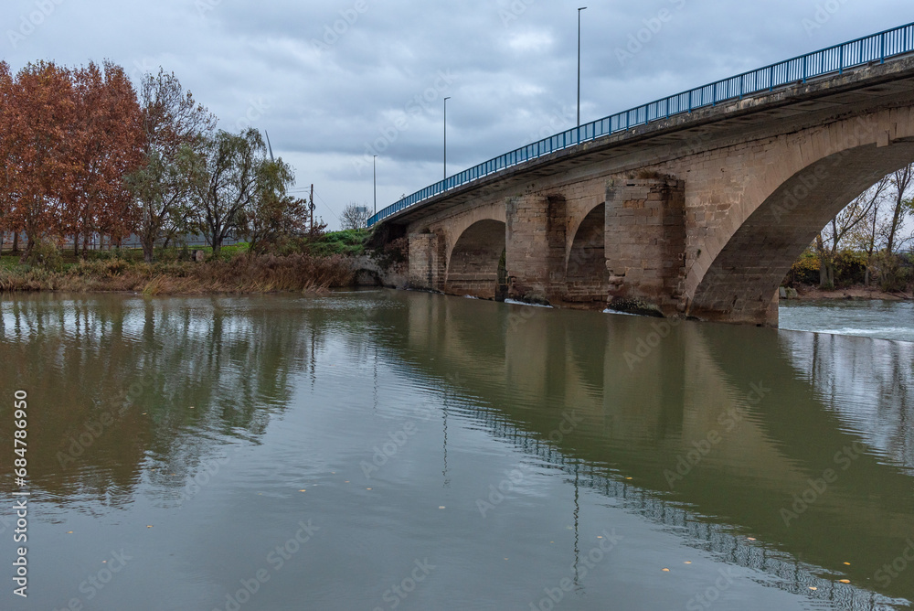 Berbinzana Bridge over the Arga River in autumn. Navarre