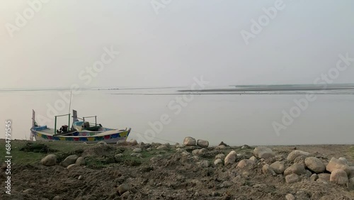 Sindh River Boating royalty.Aerial view of Sindh River Boating.People In Boats traveling in Sindh River and enjoy. Pakistani fishermen in Layyah Punjab go fishing on the river.Boat with load floating. photo