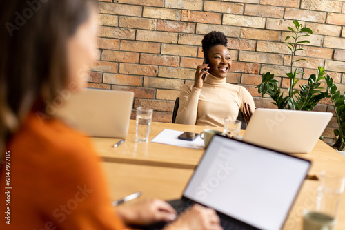 Two young business women wo...