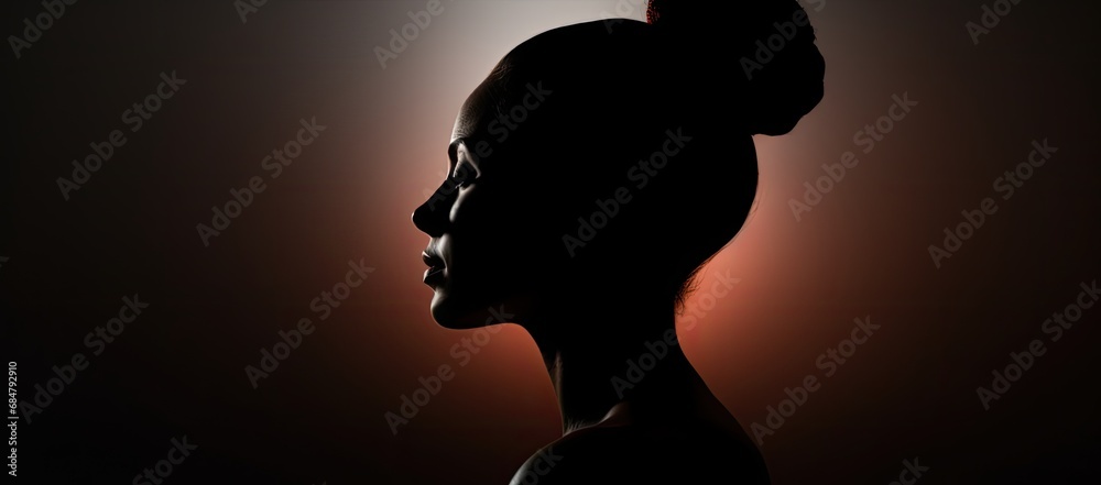  a silhouette of a woman's head against a black background with the sun behind her and a red light behind her.