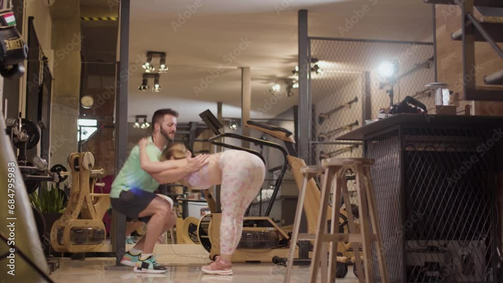 Couple in love dancing bachata and tango. Boy and girl having fun during exercise break in a fitness studio. Couple in love dancing bachata and tango. Boy and girl having fun during exercise break in a fitness studio.