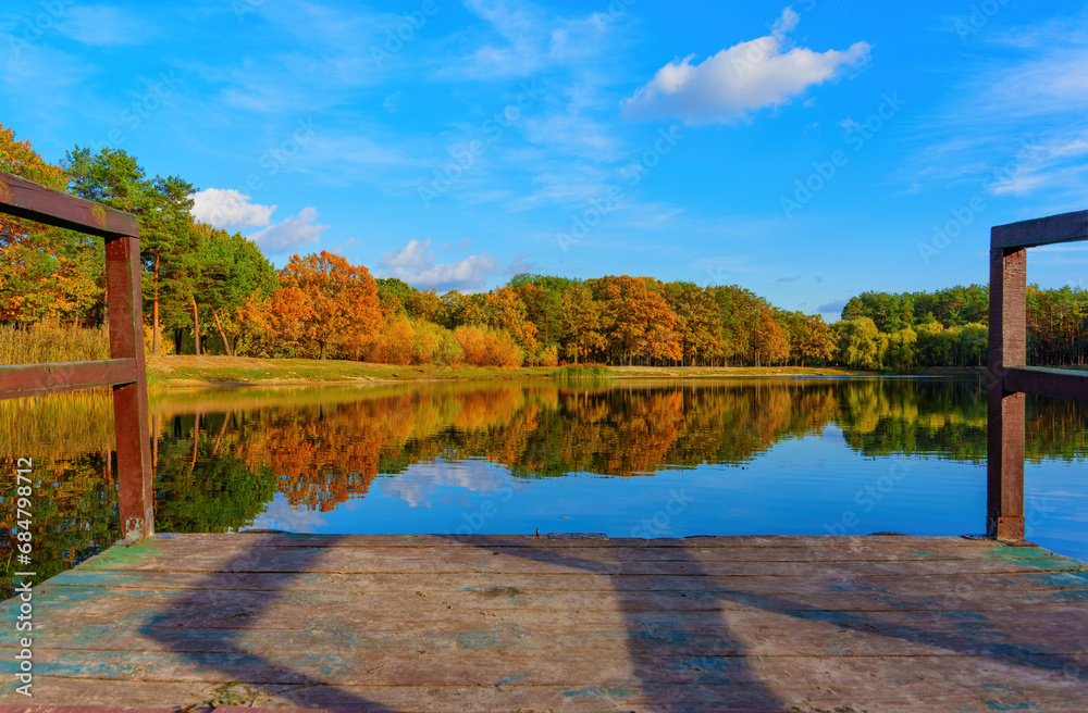 Fototapeta premium Autumn Forest Lake Seen from the Dock