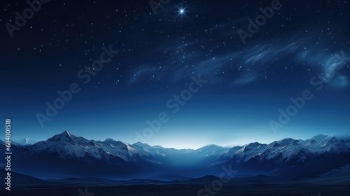  a view of a mountain range at night with a star in the sky over the top of the mountain range.