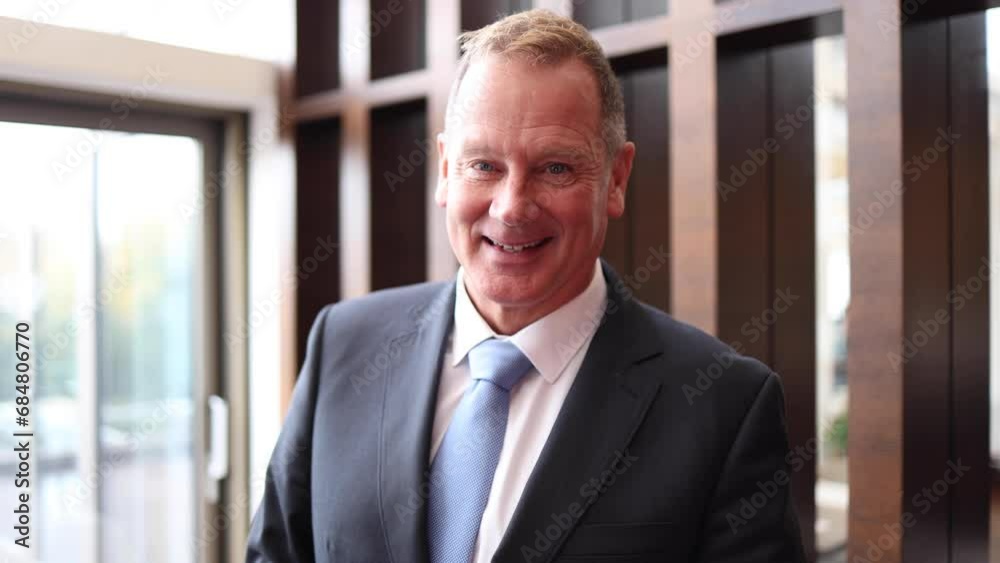 Happy businessman on a hotel conference Happy businessman on a hotel conference